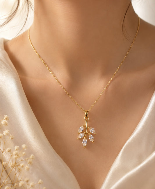 NAXAYA Aurora Leaf Pendant Necklace – Gold-Plated Crystal Elegance