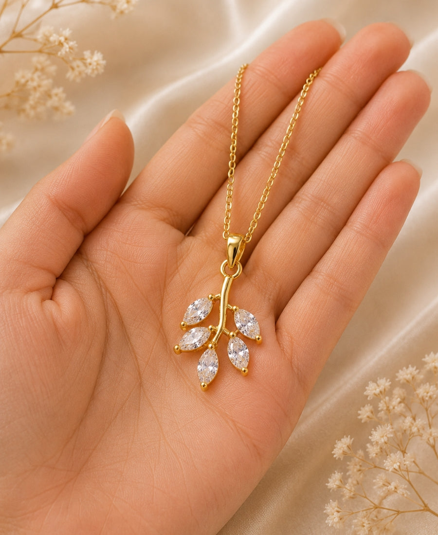 NAXAYA Aurora Leaf Pendant Necklace – Gold-Plated Crystal Elegance