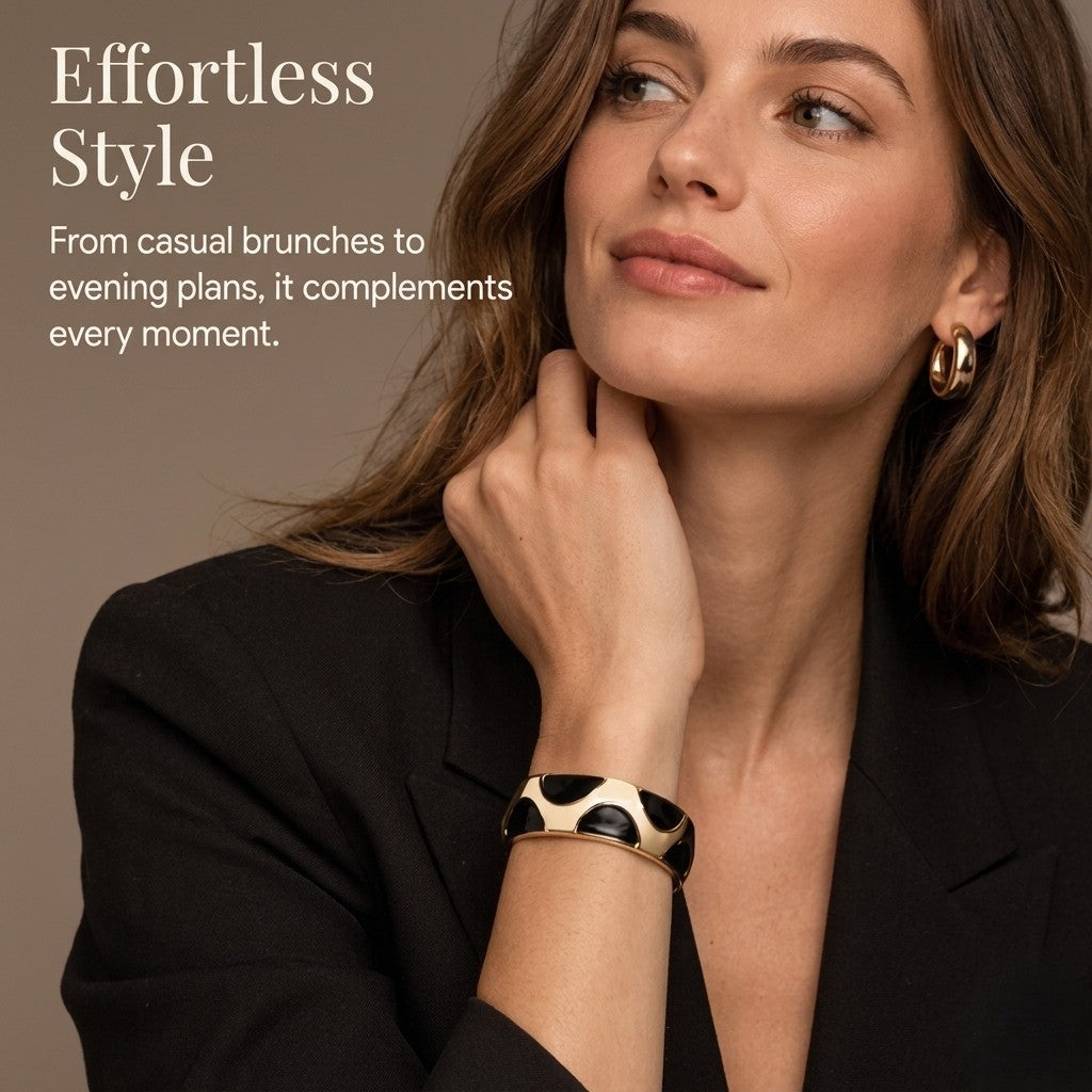 Model styling NAXAYA Modern Noir black and gold-tone kada bracelet with a black blazer, with the caption Effortless Style.