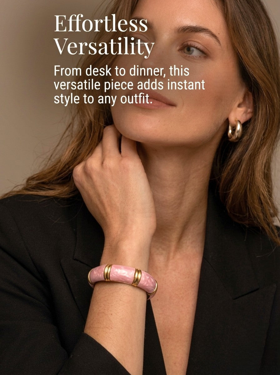 NAXAYA Aura Pink marble-effect enamel bangle with gold-tone ridges and a black blazer.