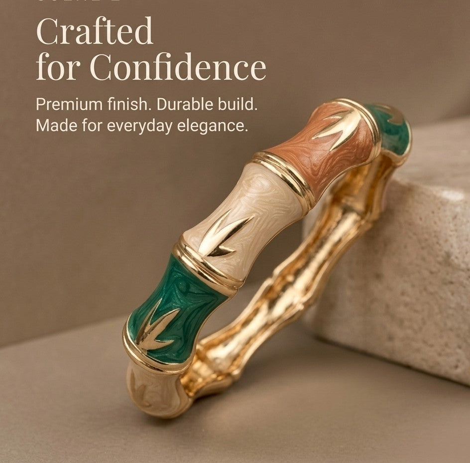 NAXAYA Bamboo Muse bamboo-design enamel bangle on beige stone with the caption Crafted for Confidence.