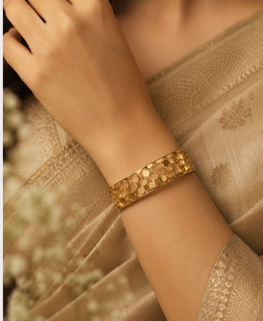 Woman wearing NAXAYA Hexovra bracelet with traditional saree styling